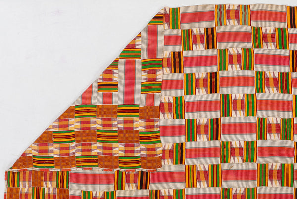 Colorful patterned fabric with a geometric design on a white background