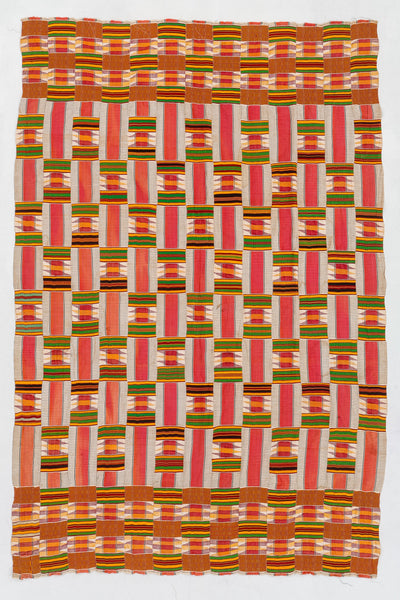 Woven fabric with a geometric pattern in red, green, and orange on a white background